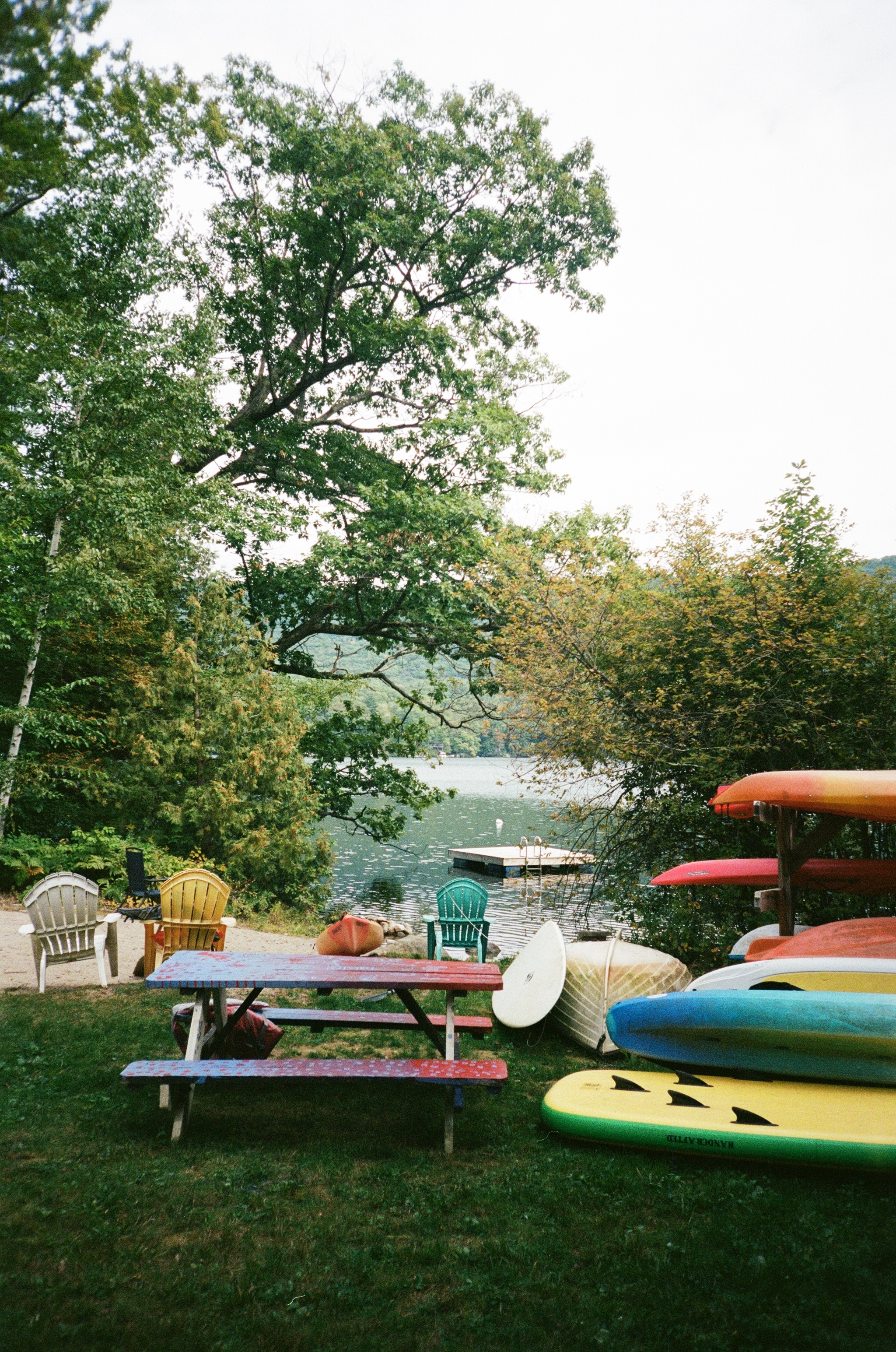 Lakeside with kayaks and picnic table